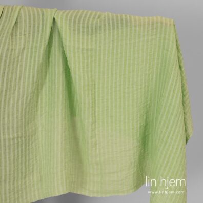 Vasket linstoff med lysegrønne striper.