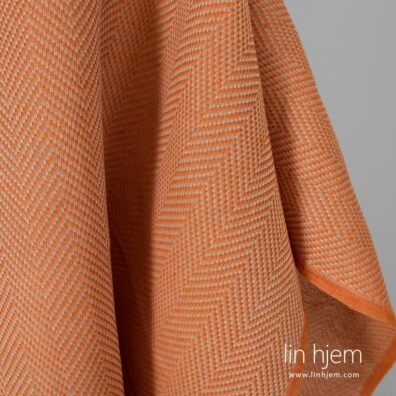 Lin-bomulls stoff i oransje.