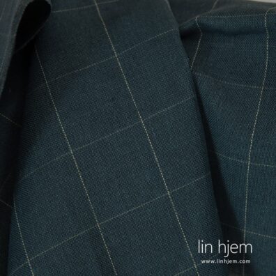 Grått-blått halvlin stoff i ruter.