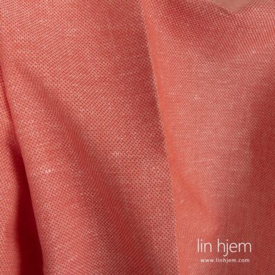 Mønstret lin-bomulls stoff i rød farge.