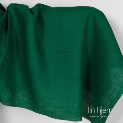 Grønt linstoff i hvite striper.