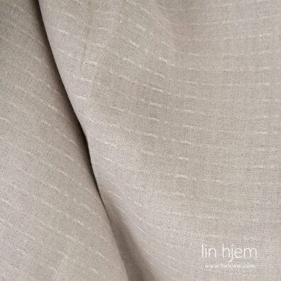 Mønstret 100% linstoff i naturlig farge.