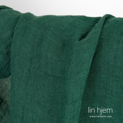 Grønt vasket gjennomsiktig linstoff.