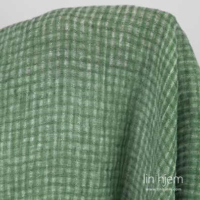 Rutete vasket grønt linstoff.