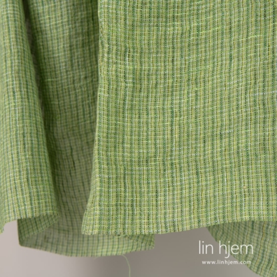 100% linstoff i grønn farge, gjennomsiktig, vasket.