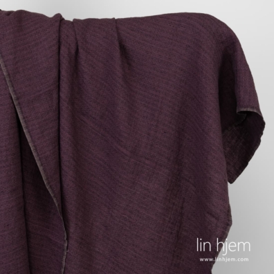 Mønstret vasket lilla linstoff.