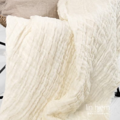 Linpledd i gulaktig farge.