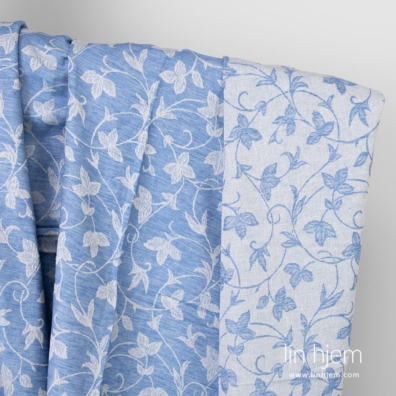 Blått jacquard halvlin stoff.