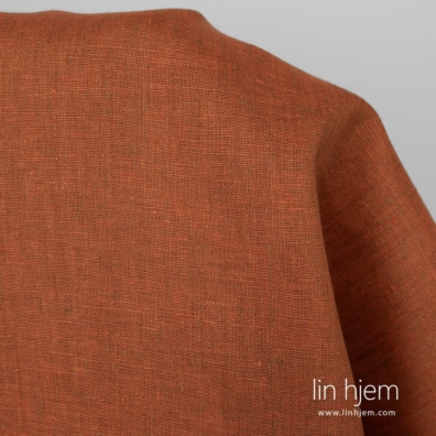 100% linstoff i oransje farge.