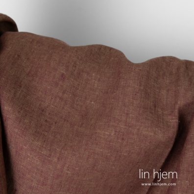 100% linstoff i lilla, grønnaktig farge.