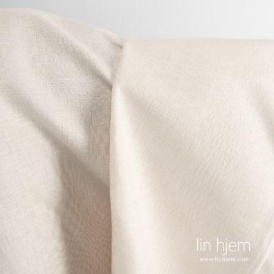 Rutete gulaktig halvlin stoff.