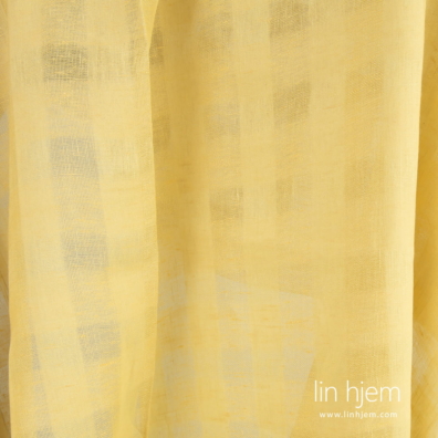 Gult gjennomsiktig linstoff i ruter