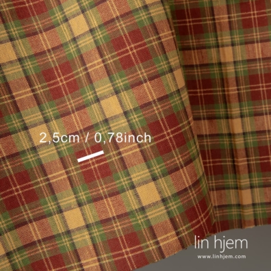 Halvlinstoff med røde, grønne og gule ruter