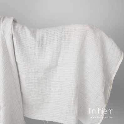 Lys grått gjennombrudd linstoff, vasket