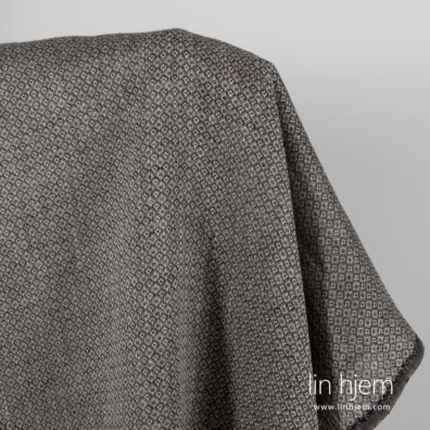 Linstoffet grått med sorte diamanter for å sy klær og hjemmetekstiler