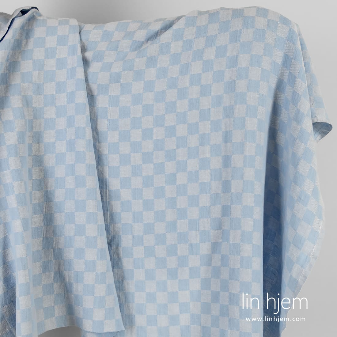 Halvlin stoff blåaktig rutete vasket