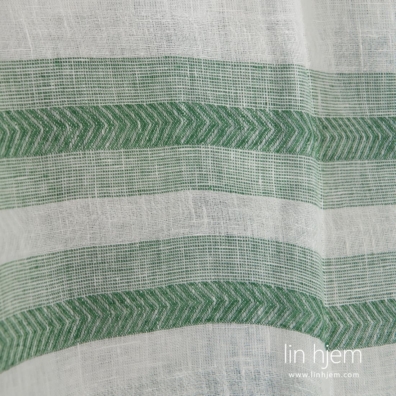 Linstoff mønstret vevd av optisk hvit og grønn garn