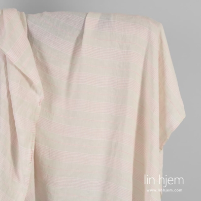 Linstoffet gulaktig med rosa striper vasket