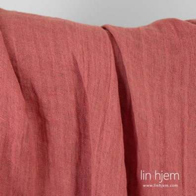 Tosidig linstoff vevd av mørk rosa og lysebrunt (lys leire) garn