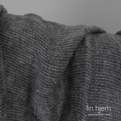 Lett linstoff fin mønstret, vevd av svart og hvit garn