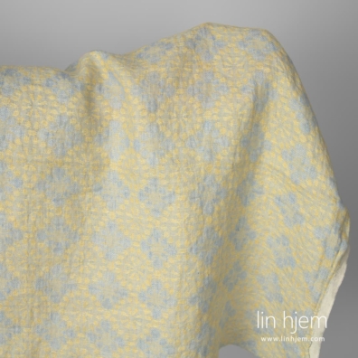 Gult floral linstoff vasket