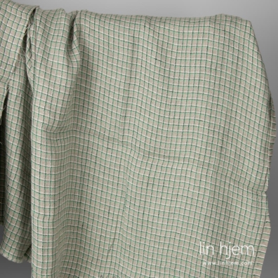 Grått linstoff med grønne ruter vasket