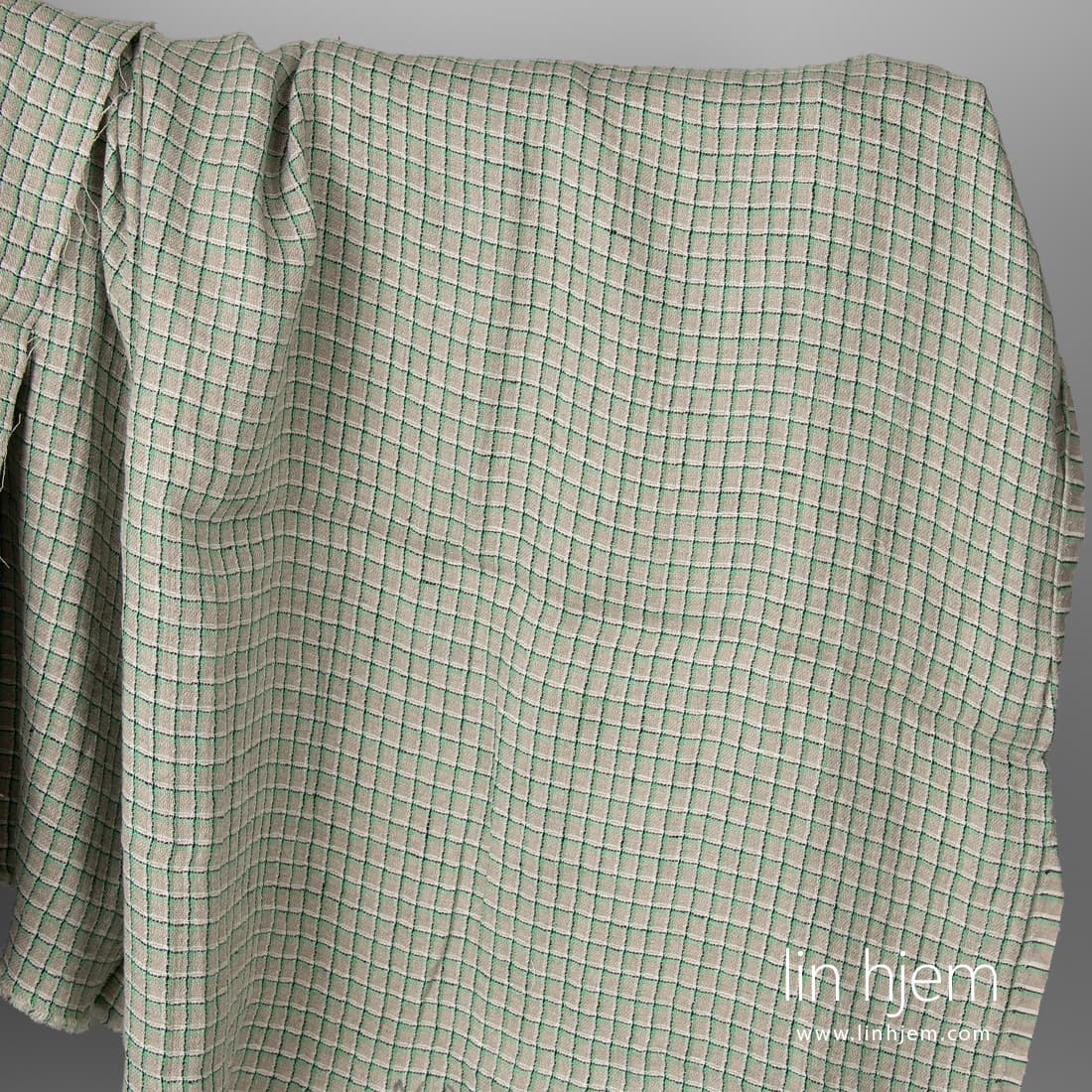 Grått linstoff med grønne ruter vasket