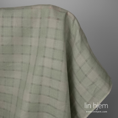 Linstoff grønt med gjennomsiktige striper vevd av grønt og grått garn, melange