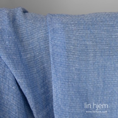 Lett linstoff vevd av blått og hvitt garn, melange