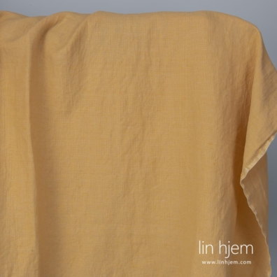 Halvlin stoff gul-brunt mønstret vasket