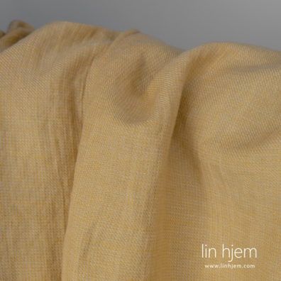 Halvlin stoff gul-brunt mønstret vasket 145cm bredt