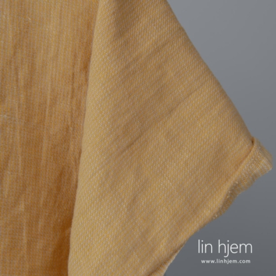 Halvlin stoff gul-brunt mønstret vasket egner seg til å sy klær og hjemmetekstiler