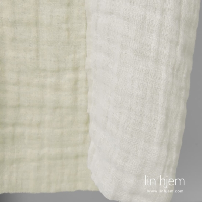 Linstoff tosidig vevd av knallhvitt og gulaktig garn