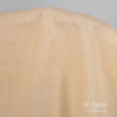 Linstoff gulaktig med gjennomsiktige striper for å sy klær, hjemmetekstiler