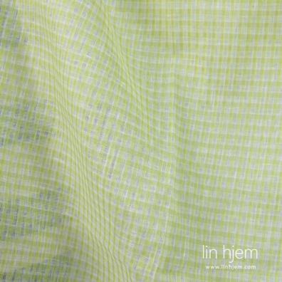 Linstoff med gjennomsiktige ruter vevd av knallhvitt og lysegrønt garn