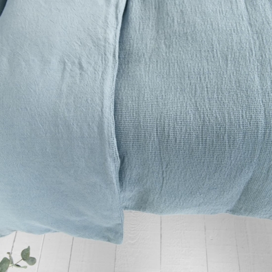 Blått vendbar lin-bomull dynetrekk i "vaffel" mønster og vanlig vev