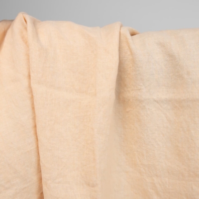 Linstoff vevd av vaniljefarget (gulaktig hvit) og brunlig-gult garn, melange, vasket