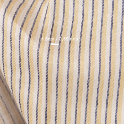 Linstoff med vertikale striper i twill mønster vevd av ingefærgul, mørk blå, beige og bleket kakao farget garn