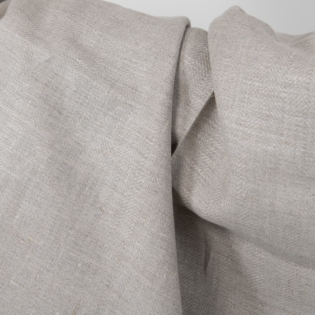 Linstoff naturfarget i "fiskebeinsmønster" er sterkt, tett og middels tykt