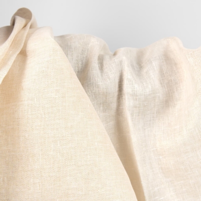 Stoff vevd av melkehvitt (gulhvitt) lin og gyllent polyestergarn, melange