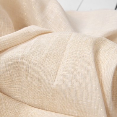 Gulaktig blankt linstoff med en gyllen glans