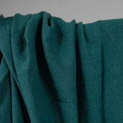 Linstoff mørk turkis 285cm bredt vasket