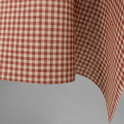 Linstoff vevd av brunlig (lys beige) og brunrødt garn