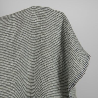 Grønngrått mønstret linstoff vasket passer til å sy klær og hjemmetekstiler