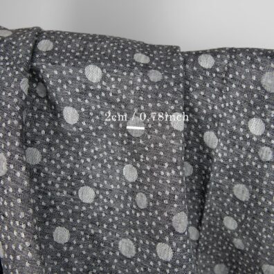 Svart og hvitt prikket linstoff jacquard tosidig 150cm bredt