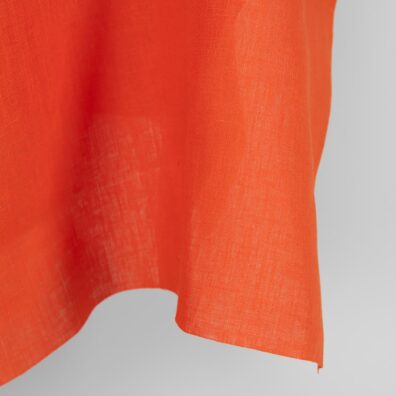 Linstoff i sterk oransje til klær, hjemmetekstiler