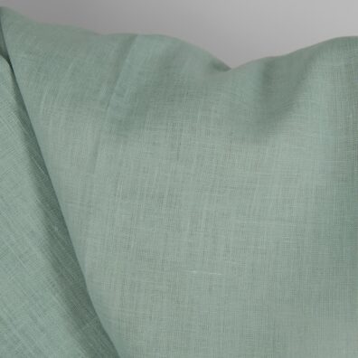 Linstoff i lys blågrønn farge til klær, hjemmetekstiler