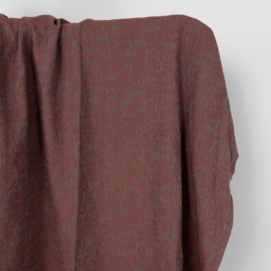 Halvlin stoff grå-brunt mønstret vasket