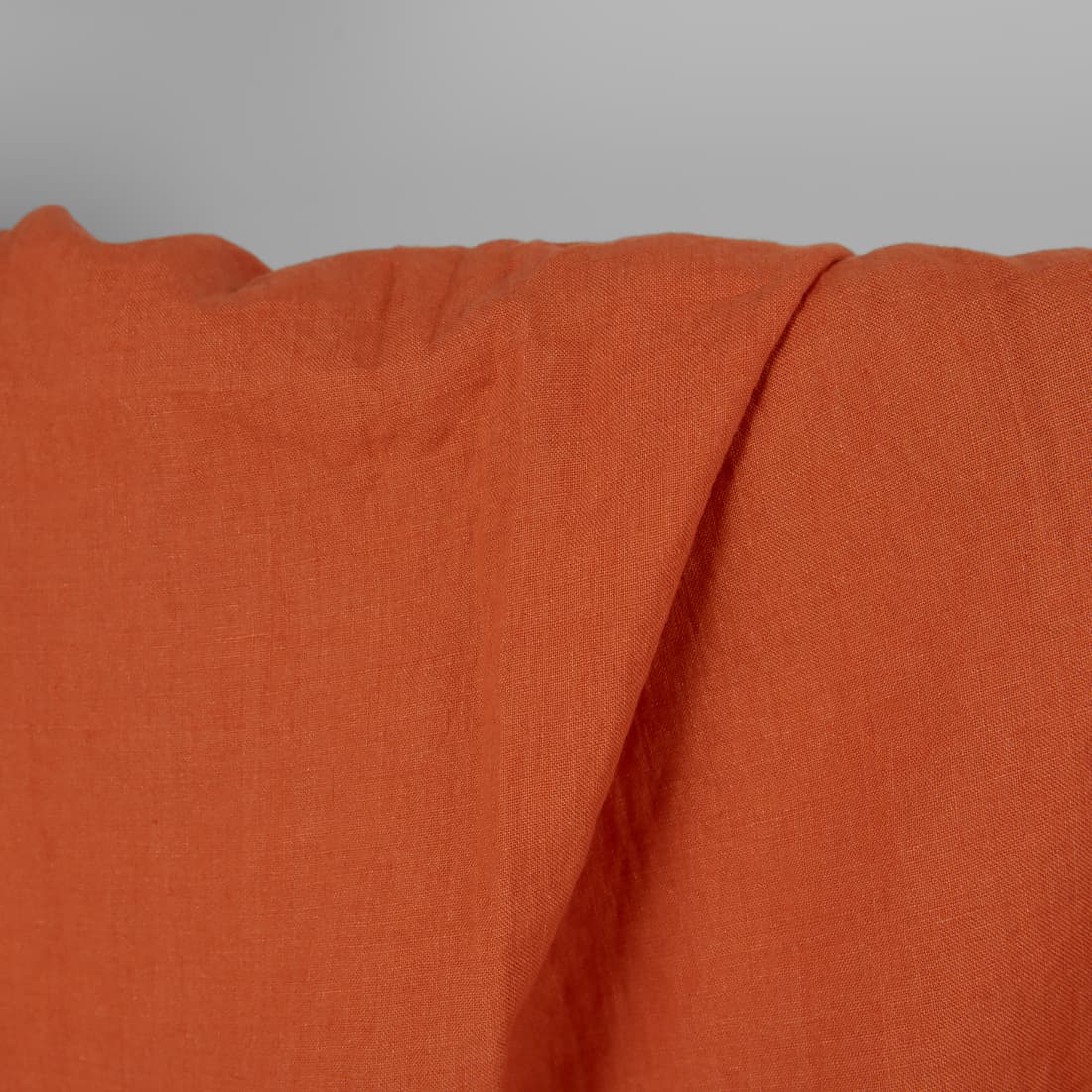 Linstoff mørk oransje vasket, mykt, skånsomt