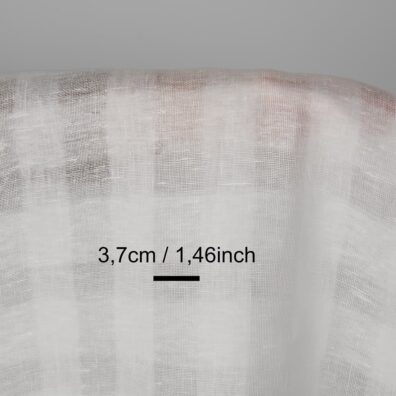 Linstoff snøhvit i gjennomsiktige ruter for sying klær, hjemmetekstiler